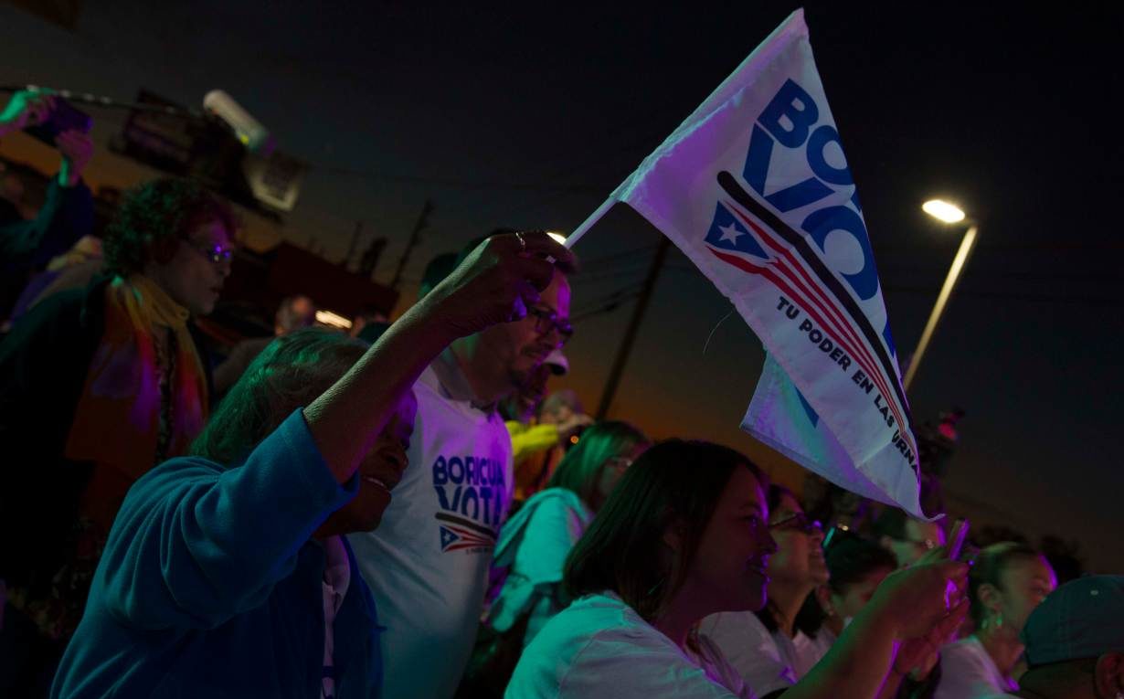 Supporters of Puerto Rican activist group Boricua Vota (A Puerto Rican Votes) watch a show held as part of a voter registration drive in Orlando, Florida, in March.