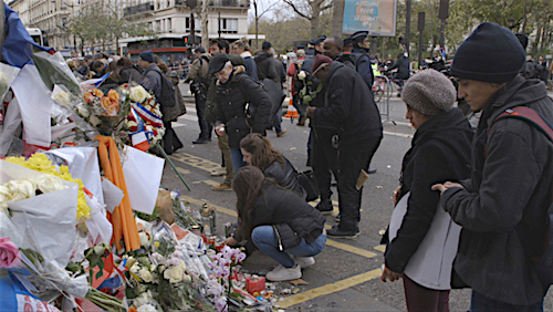 Yudith Nieto and Emmanuel Guajardo of T.E.J.A.S. at a memorial to victims of last month's terrorist attacks in Paris